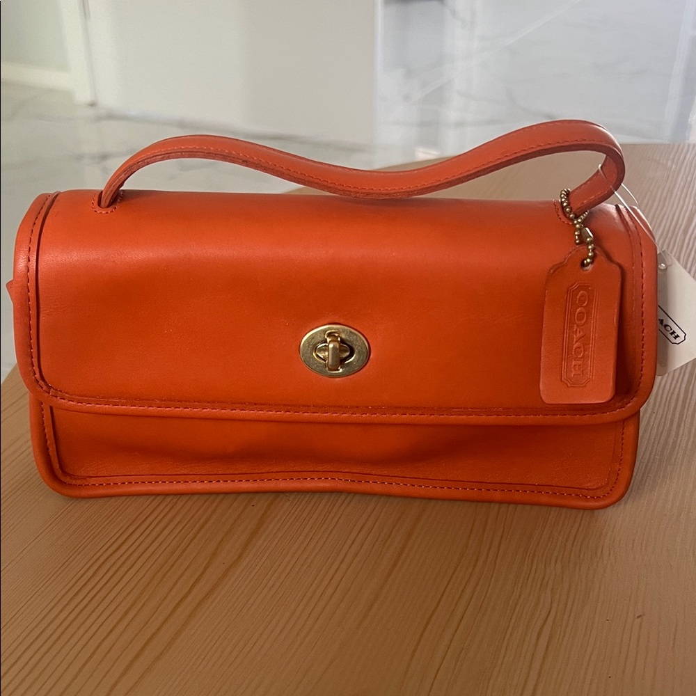 Rare Never Used vintage Coach Orange Leather Bag with hangtag and o.g price tag!